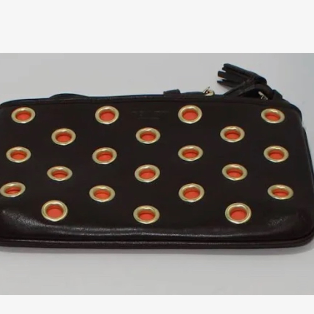 Coach wristlet. Brown and orange grommet wristlet